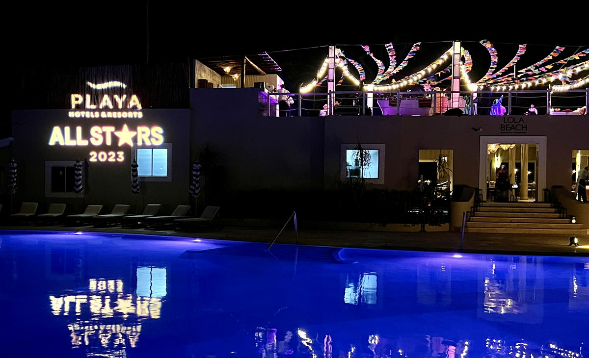 A Playa All Stars logo lights up the pool at night. (Pax Global Media)