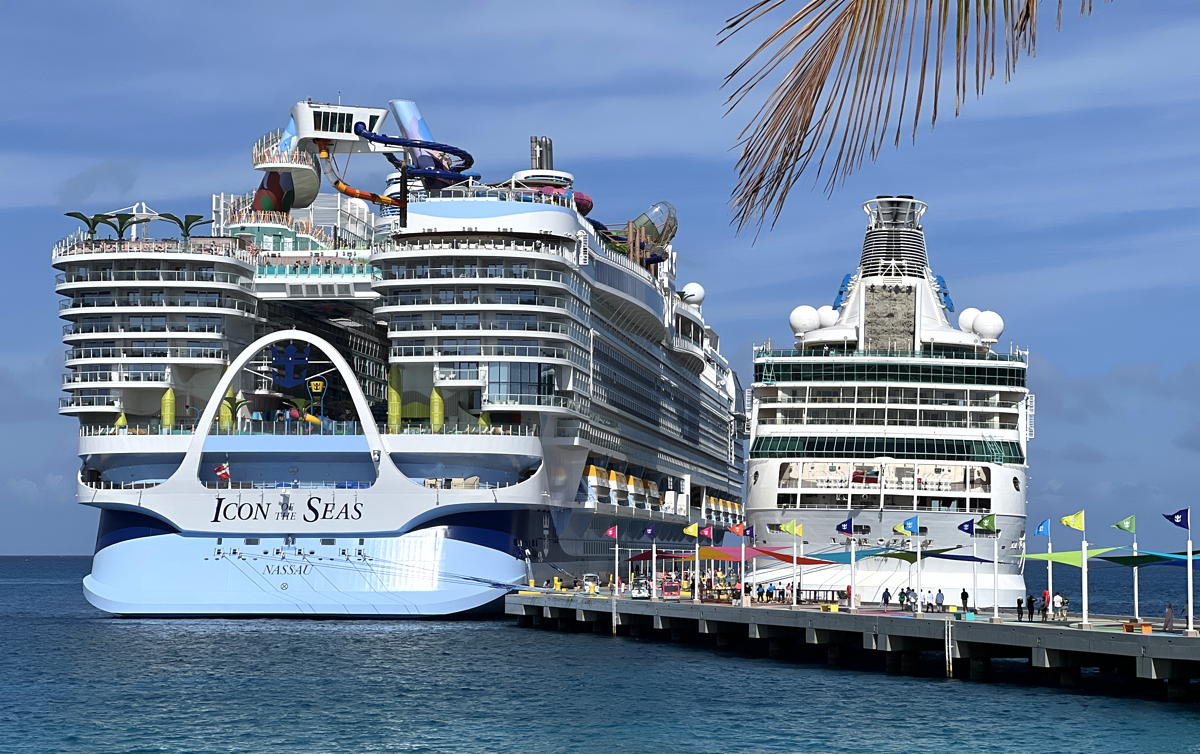 Icon of the Seas parked next to Vision of the Seas. (Pax Global Media)