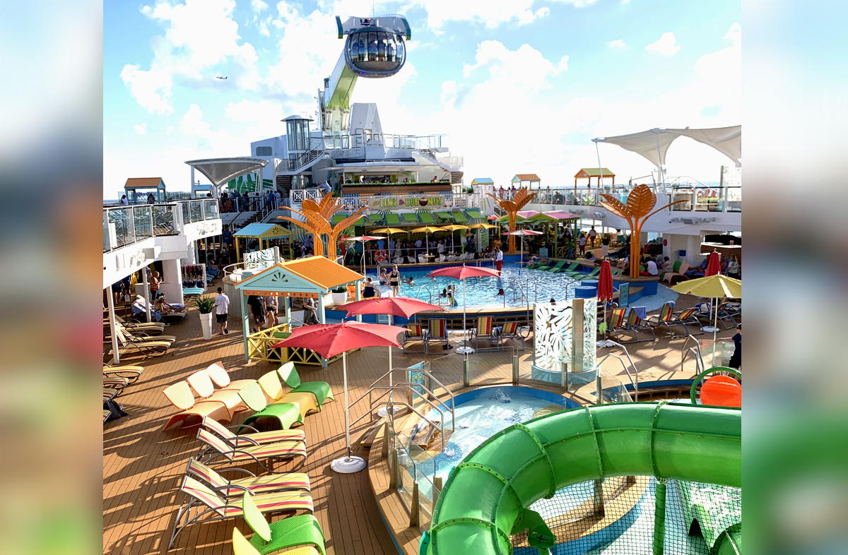 The main pool is a bold space featuring bright orange, red, pink, sky blue, lime green and yellow decor with a Caribbean theme. (Diane Tierney)