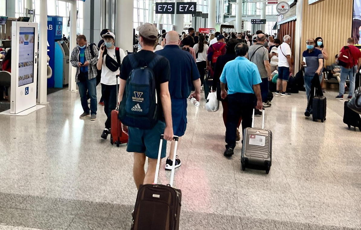 Travellers pass through Toronto Pearson airport. (Pax Global Media/file photo)