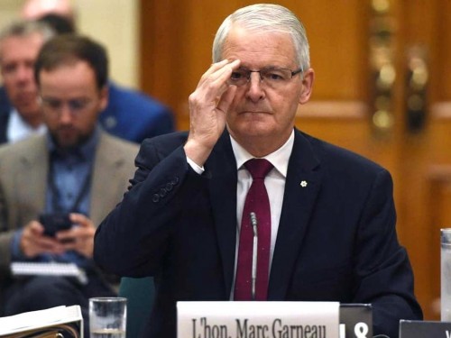 Garneau to quarantine in hotel; 500+ tickets issued; no fines reported in AB, QC