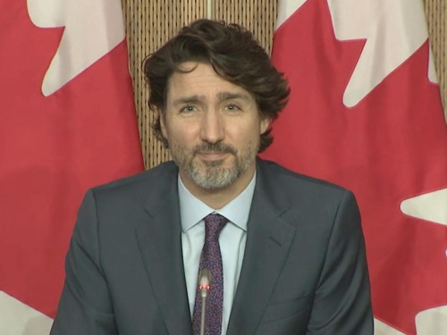 Canadians might be able to travel internationally by summer, Trudeau says