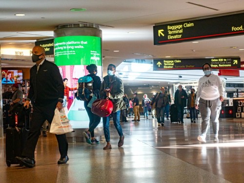 New U.S. travel rules begin today; data on Omicron’s severity is “encouraging,” says Dr. Fauci