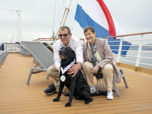 Service dog cruises into elite status after sailing 700 days with HAL