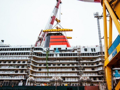Queen Anne crowned with iconic red & black Cunard funnel