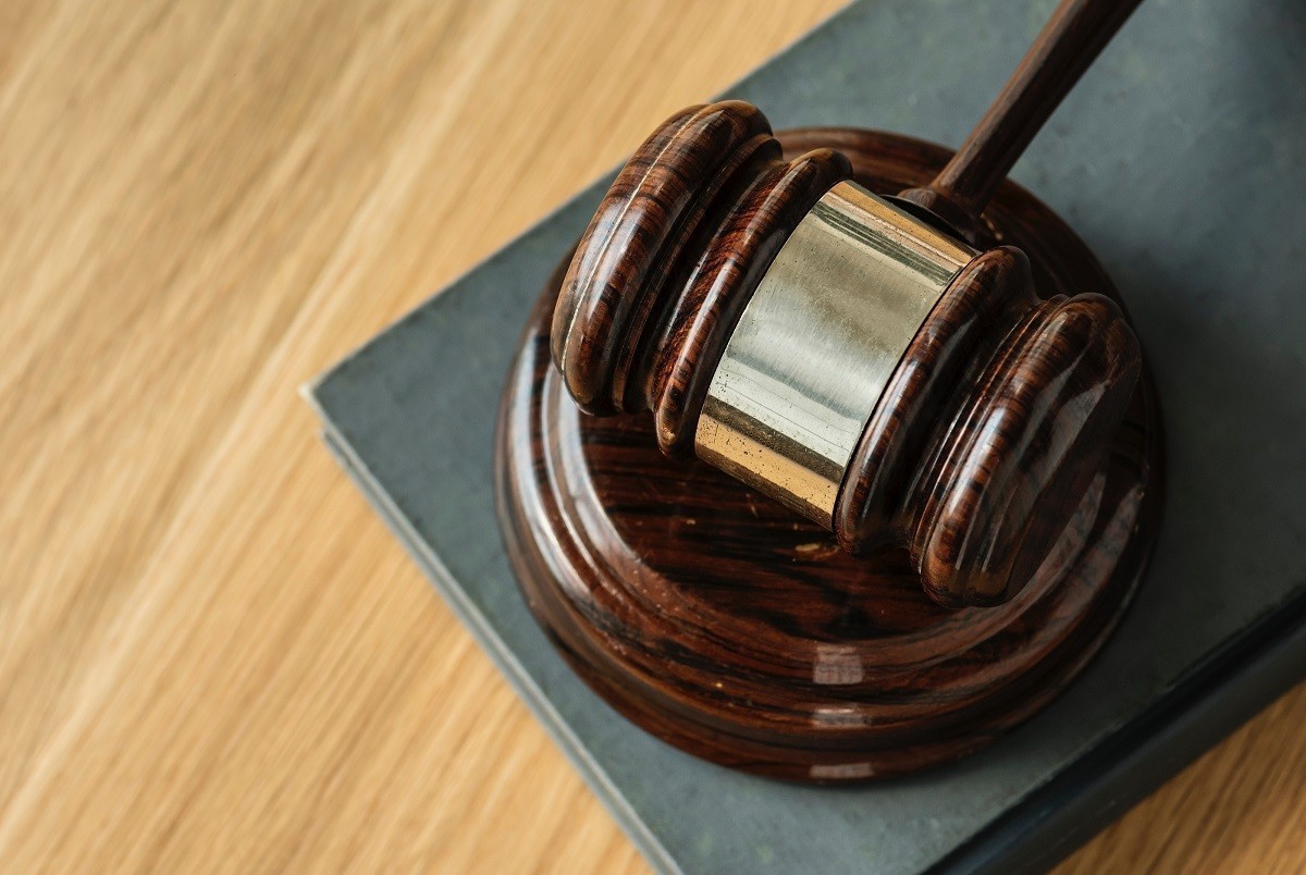 Four charged for operating as a travel agent without being registered